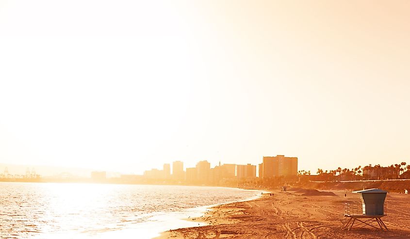 Deserted sea shore of Long Beach at sunset