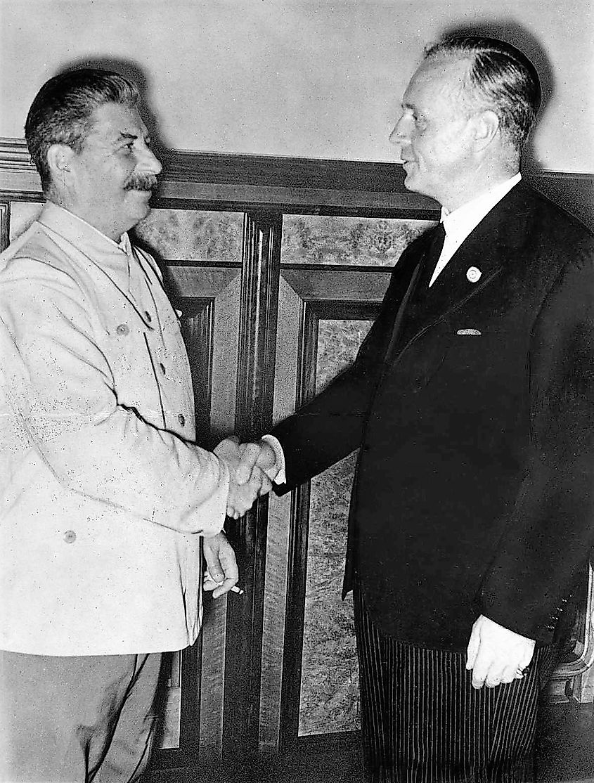 Stalin and Ribbentrop shaking hands after the signing of the pact in the Kremlin