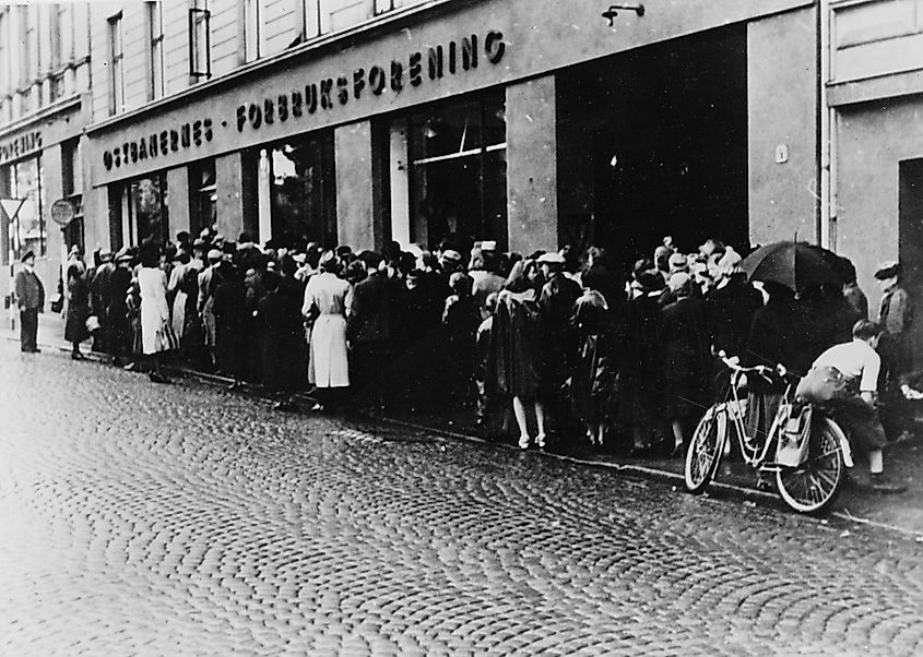 The occupation saw a great rise in food shortages throughout Norway. Here people wait in line for food rations, Oslo, 1942.