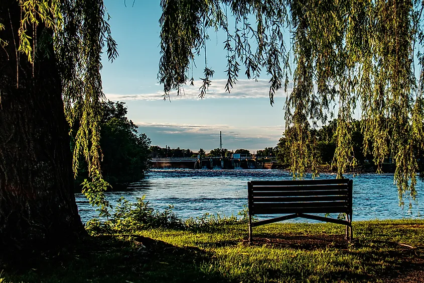  A bench in a park along the Mississippi River in Little Falls, MN.