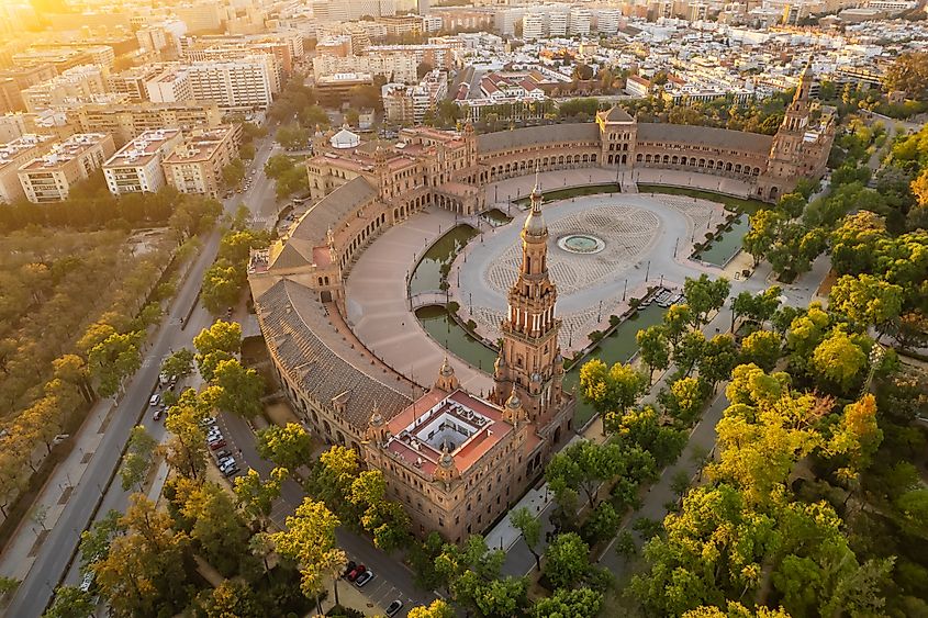 Plaza de Espana at sunrise in Seville, Spain. Aerial drone photo of the famous Spanish Square and Maria Luisa park in the morning in Seville. Beautiful morning light at Spanish square in Seville