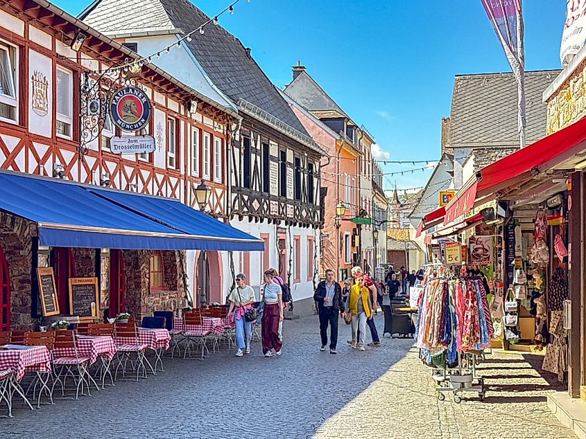 People walking along one of the narrow streets in the picturesque town of Rudesheim.