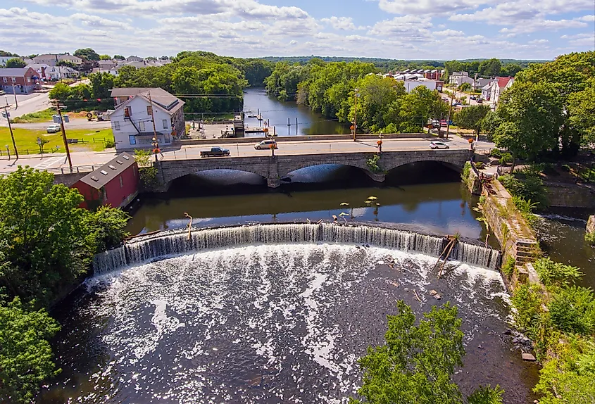 Valley Falls and Board Street bridge over Blackstone River at Valley Falls Heritage Park, Central Falls, Rhode Island.