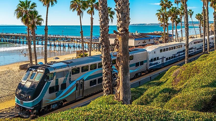 Metro commuter train entering San Clemente Pier Beach Station