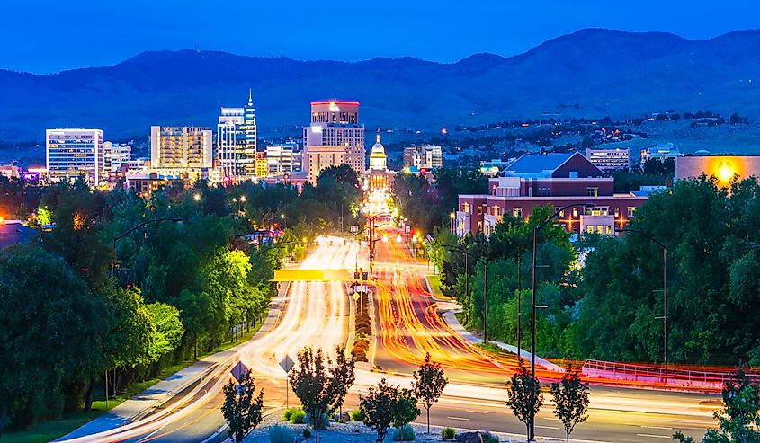 Boise cityscape at night with traffic lights.