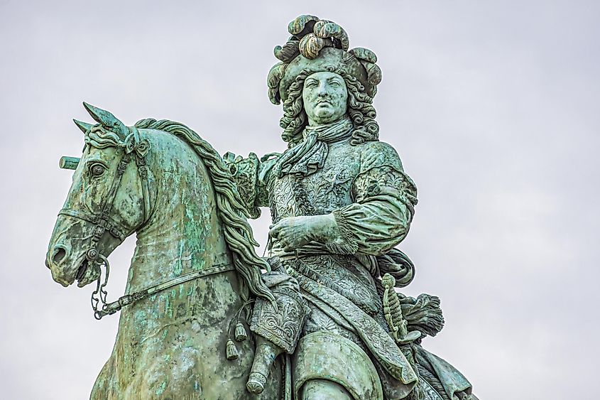 Equestrian statue of Louis XIV (Sun King) on the square in front of the palace of Versailles. Versailles, Paris, France.