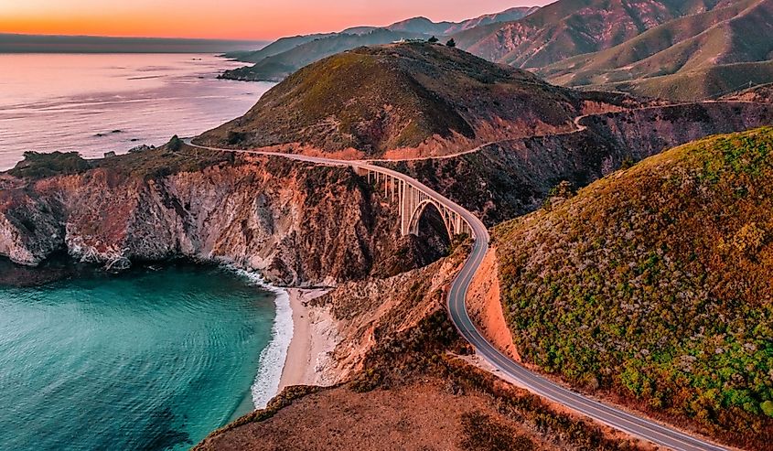 Bixby Bridge on Highway 1 and Big Sur along Pacific Ocean coast, beautiful landscape and aerial view, sunset, sunrise, fog. Concept, travel, vacation, weekend.