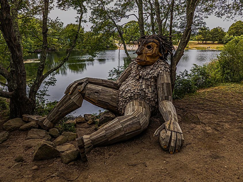 A wooden sculpture by a lake in Charlestown, Rhode Island