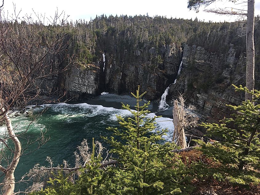 A beautiful and hidden ocean cove with a waterfall