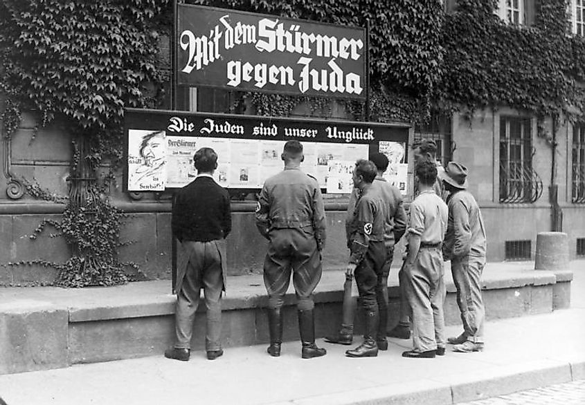  A group of Germans reading an anti-Semitic bulletin board during the Nazi regime
