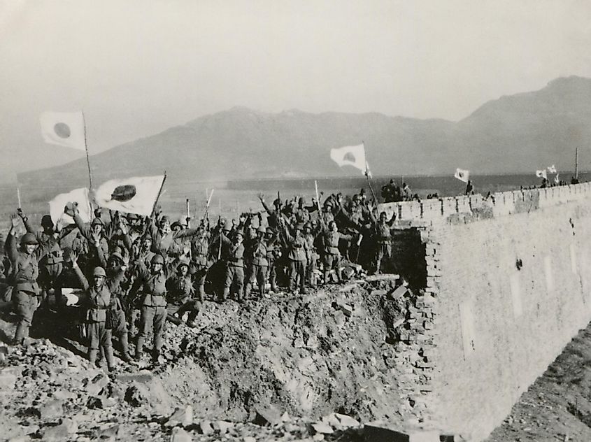 Japanese soldiers celebrate the capture of Nanking, China. 