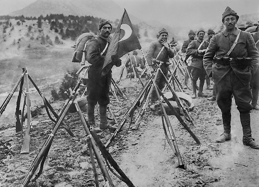Turkish infantry column at rest with rifles and flag during World War I