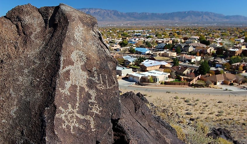Petroglyphs and nearby housing development at Boca Negra, Petroglyph National Monument, Albuquerque, New Mexico