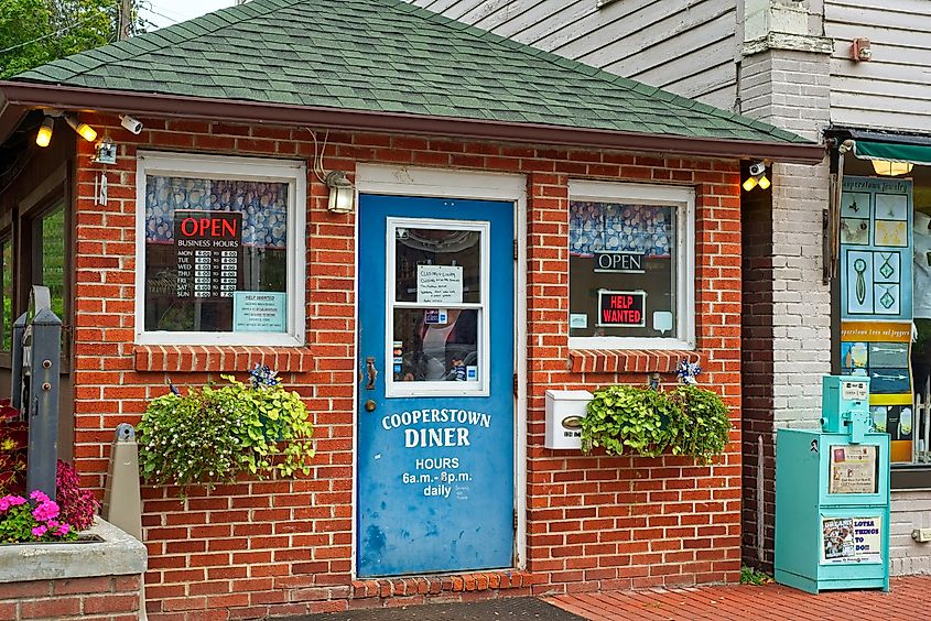 COOPERSTOWN, NY - SEPTEMBER 8, 2018: The famous Cooperstown Diner occupies a tiny space on Main Street, but it is popular with visitors and locals alike in this upstate NY town. Editorial Photo Credit: Kenneth Sponsler Shutterstock. 