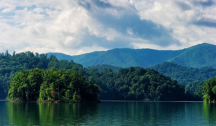 Surreal landscape view of Watauga Lake in eastern Tennessee under cloudy skies.