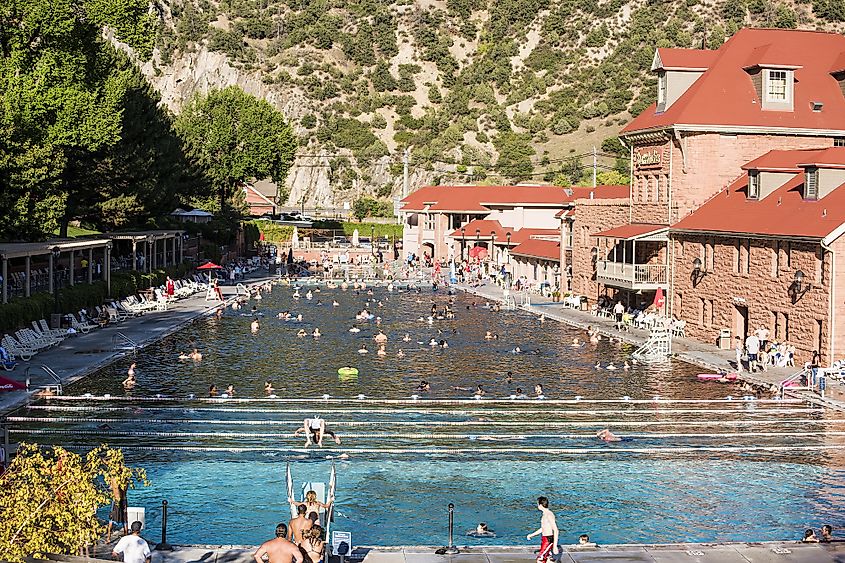 People bathe at public hot springs pool in Glenwood Springs, Colorado, USA. 