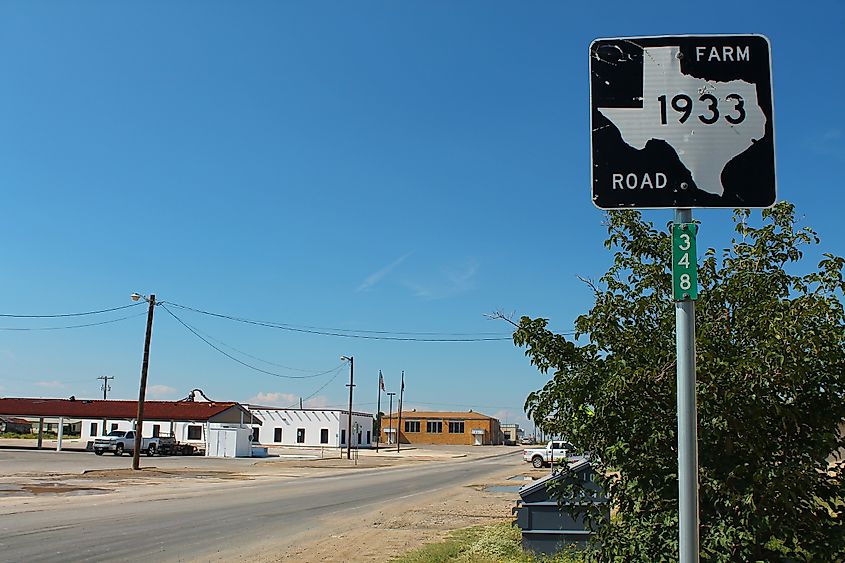 A road sign marking Mentone, Texas.