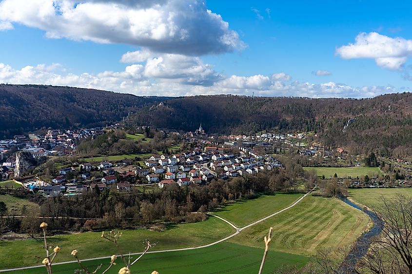 Aerial spring panorama of Blaubeuren with historic tower and Blau river, Germany