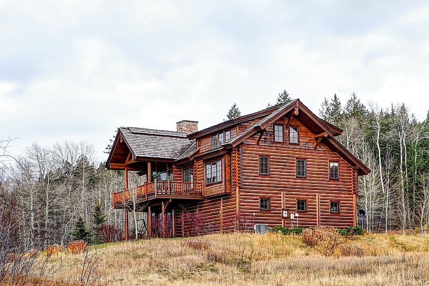 Exterior view of a modern log cabin in Victor, Idaho.