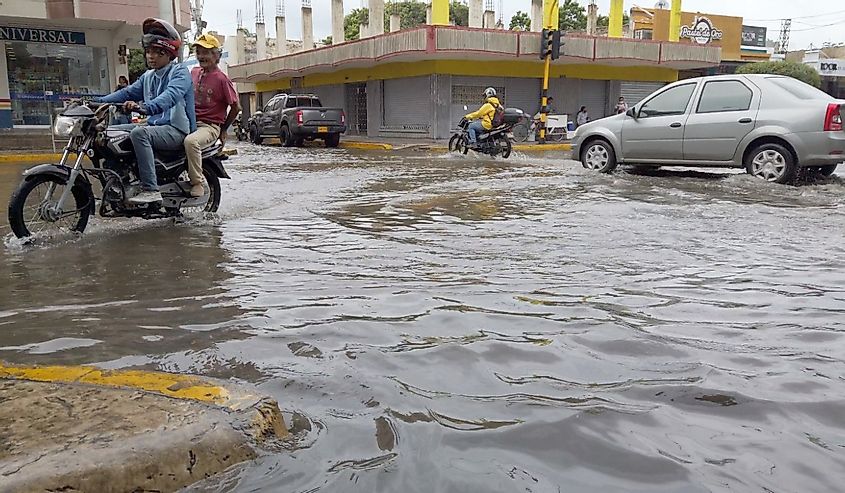 Colombia , Santa Marta august 2022 - rain and hurricane, the road is completely flooded and covered with rivers of rainwater. Climate change and global warming