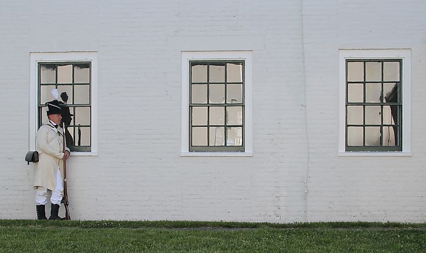 A re-enactor stands outside historic Fort Norfolk’s officer’s quarters