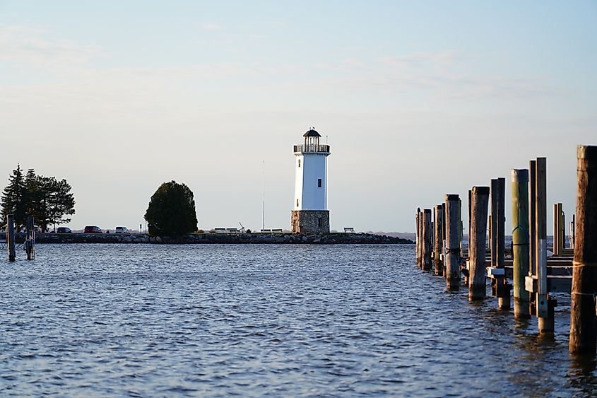 Lighthouse standing on Lake Winnebago during sunset.