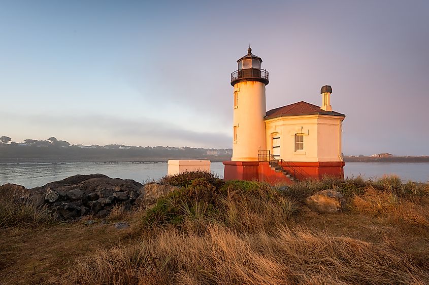 Sunrise at the Coquille River Lighthouse (1896) from Bullards Beach State Park in Bandon, Oregon.