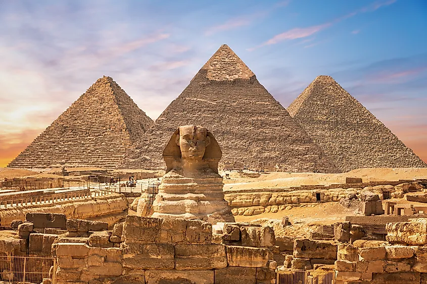 The Great Sphinx next to the Pyramids of Egypt in the sands of Giza desert.