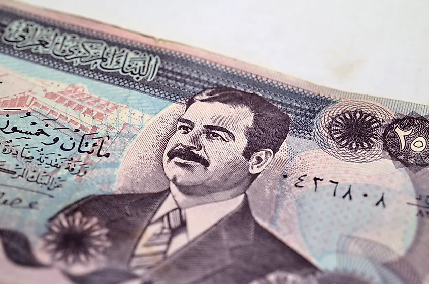 A banknote featuring Saddam Hussein.