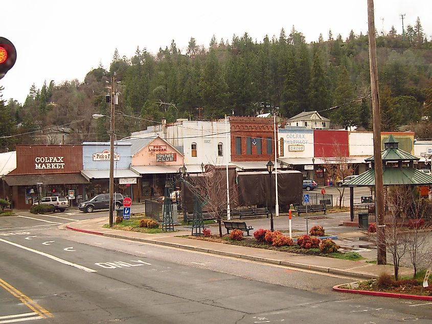 A street in Colfax, California lined with historic buildings and stores.