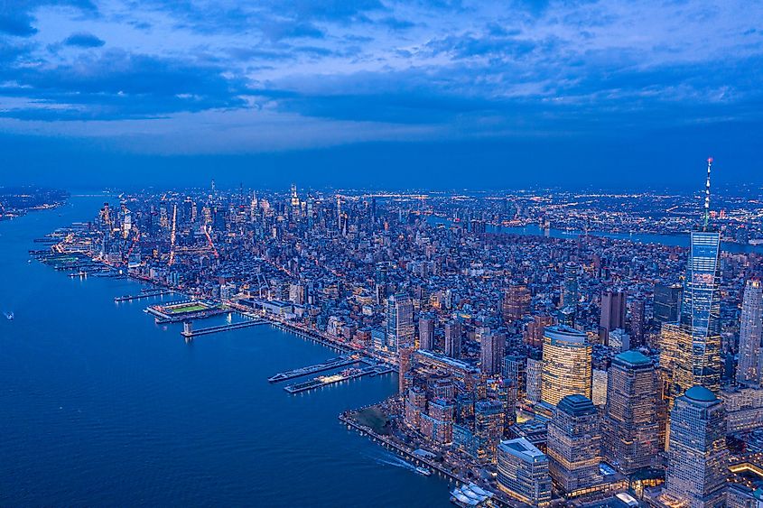Skyline of New York City from the Hudson River at dusk.