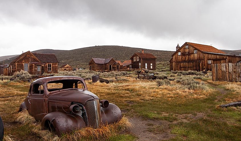 Bodie Ghost Town in California's Sierra Nevada. Abandoned vehicles and houses make for a creepy scene