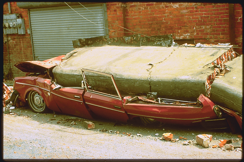 Cars crushed by a fallen brick facade in Ferndale, California