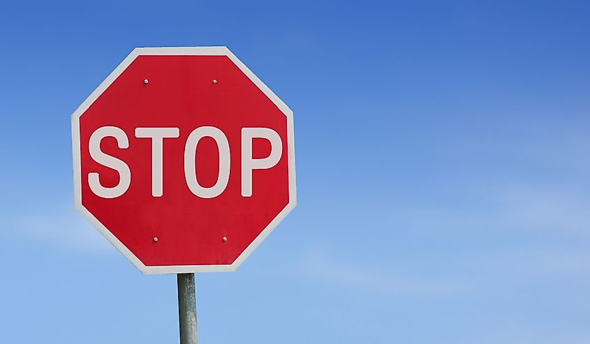 Stop sign with a blue sky background. 