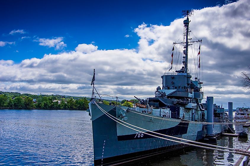 USS Slater is moored to a pier in the Hudson River, where it serves as a National Landmark and World War II maritime monument and museum in central New York.