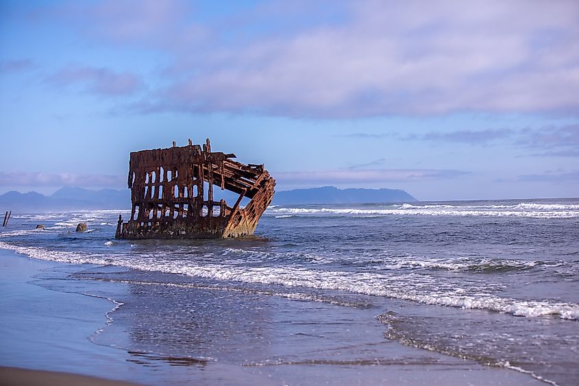 Scenic view of shipwreck on beach of Fort Stevens state park, Oregon.