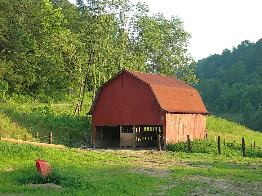 A rustic barn in Left Hand, West Virginia, surrounded by rolling countryside.