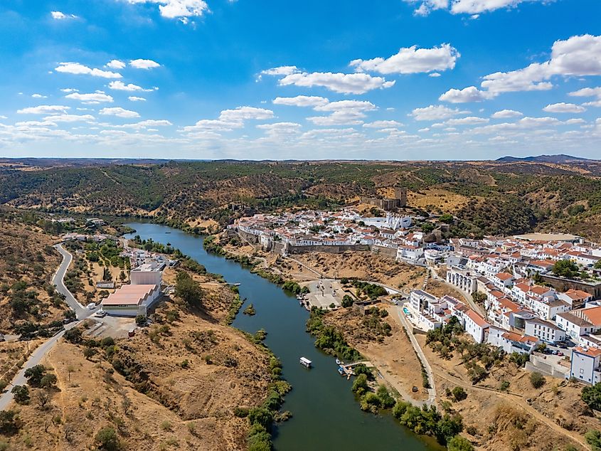 Aerial panoramic view of Mértola, Portugal, overlooking the Guadiana River.