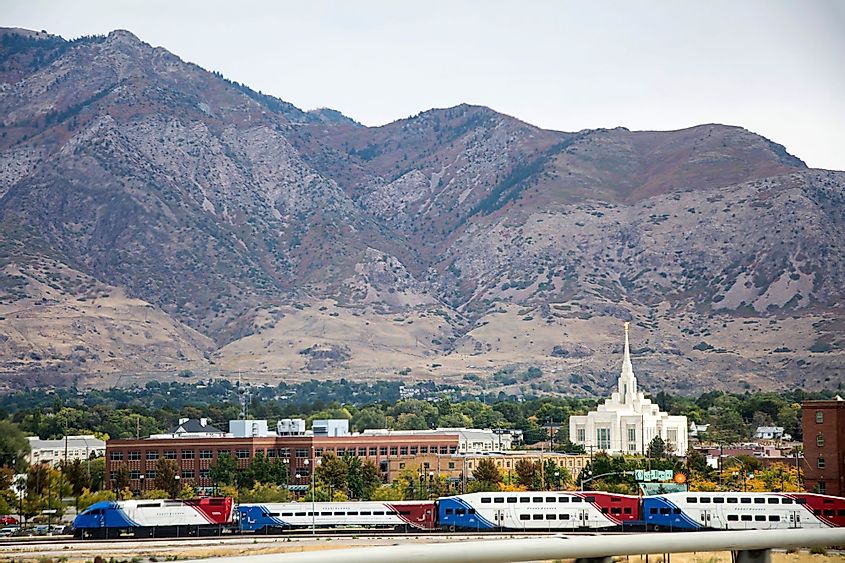 Ogden Mormon Temple with frontrunner train and old buildings