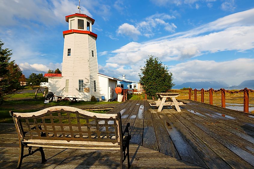 Homer Spit Lighthouse in Homer, Alaska, at sunset.