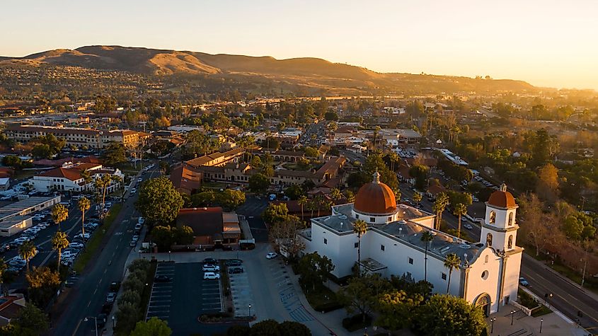 Sunset aerial view of the Spanish Colonial era mission and the surrounding downtown of San Juan Capistrano, California