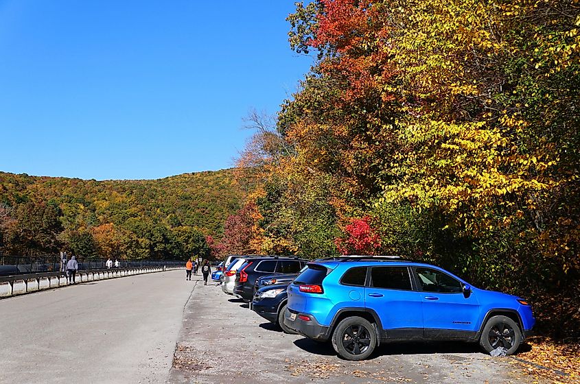 The parking lot at Lehigh Gorge State Park surrounded by the fall foliage, via Khairil Azhar Junos / Shutterstock.com