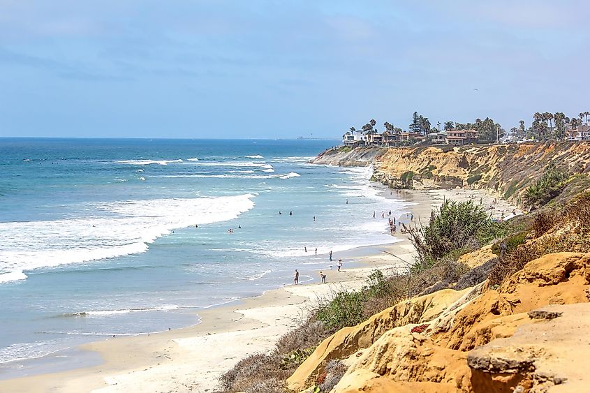 People along the beachside in Carlsbad, San Diego