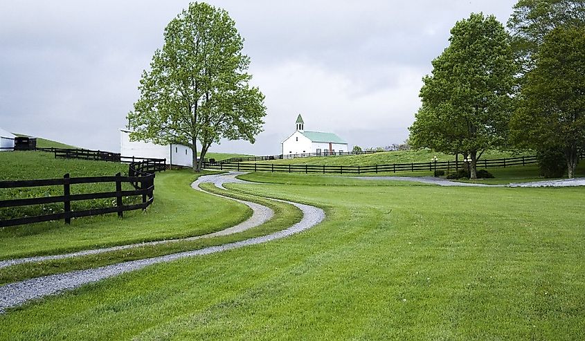 Curved driveway leading to a distant church in Marlinton, West Virginia.