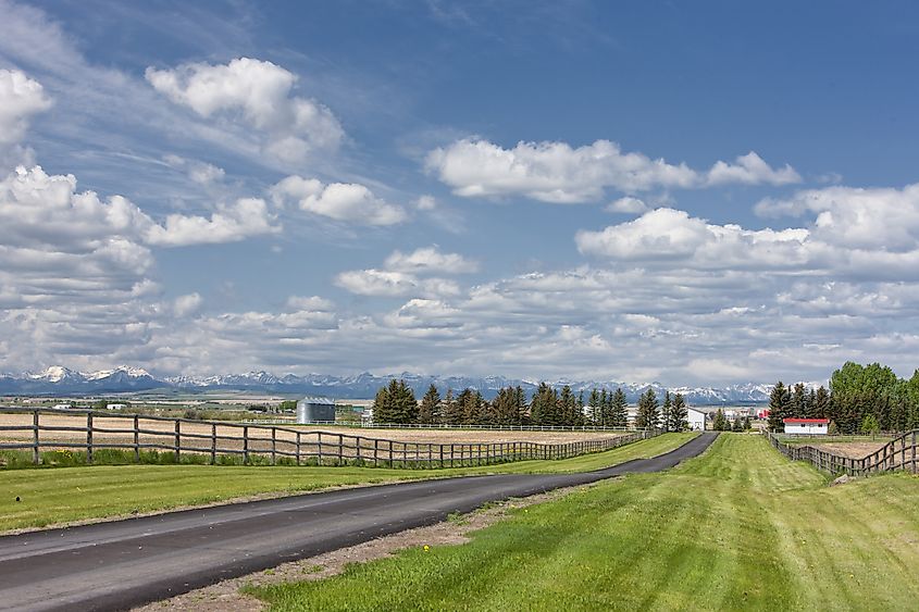 Farmland with the Rockies in the backdrop in High River, Alberta, Canada.