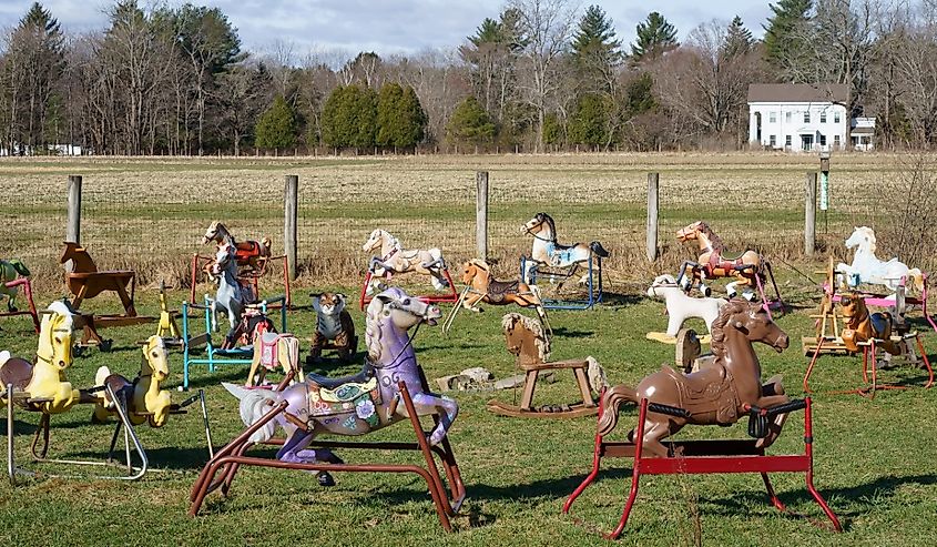 Ponyhenge, old rocking horses in the pasture field in Lincoln, Massachusetts.