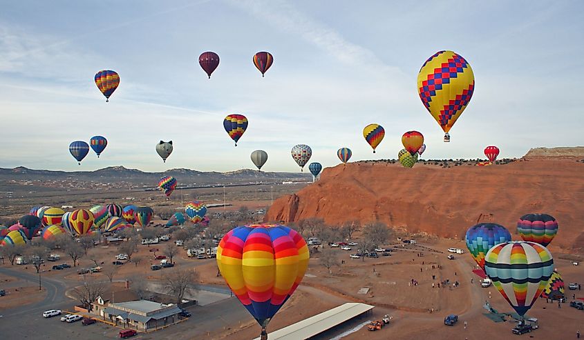 Mass hot air balloon ascension at the annual Red Rocks Balloon Festival at the Red Rocks State Park near Gallup, New Mexico.