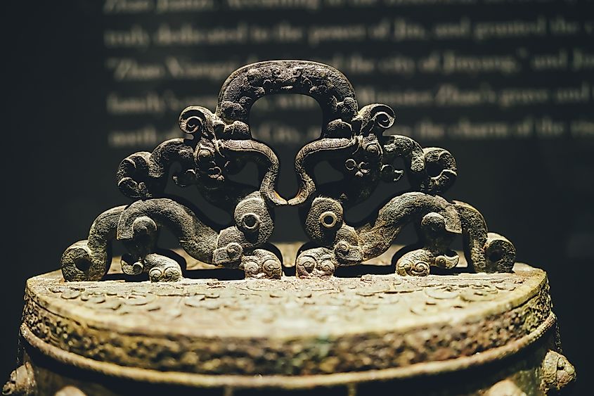 Ancient Chinese cultural relics, bronze wares from the Shang Dynasty, mainly used as dining utensils, weapons, and musical instruments. Via Shutterstock / Chloe-H