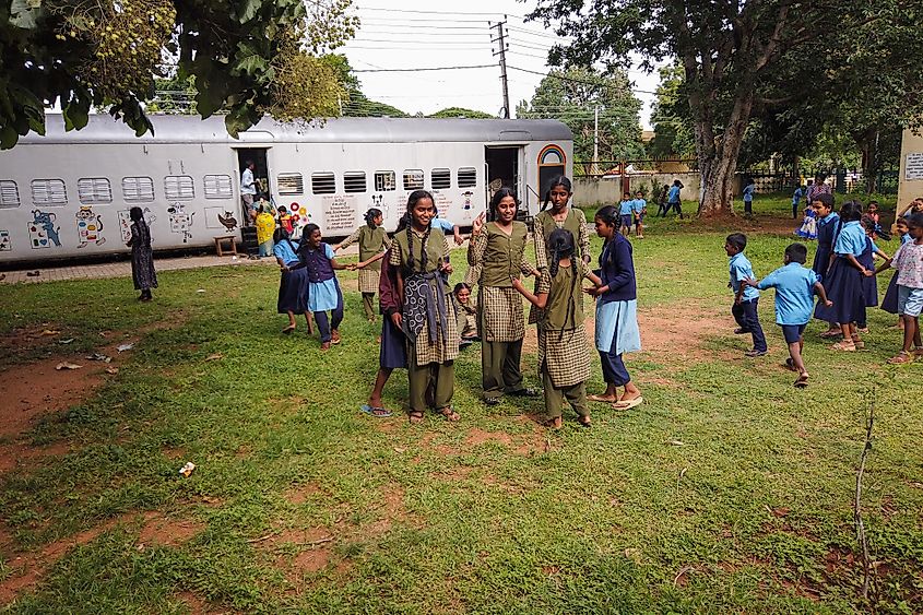 Students having a free time at the Government run Higher primary school for poor children which operates from innovative train coaches in Mysuru, India. Editorial credit: PRIYA DARSHAN / Shutterstock.com