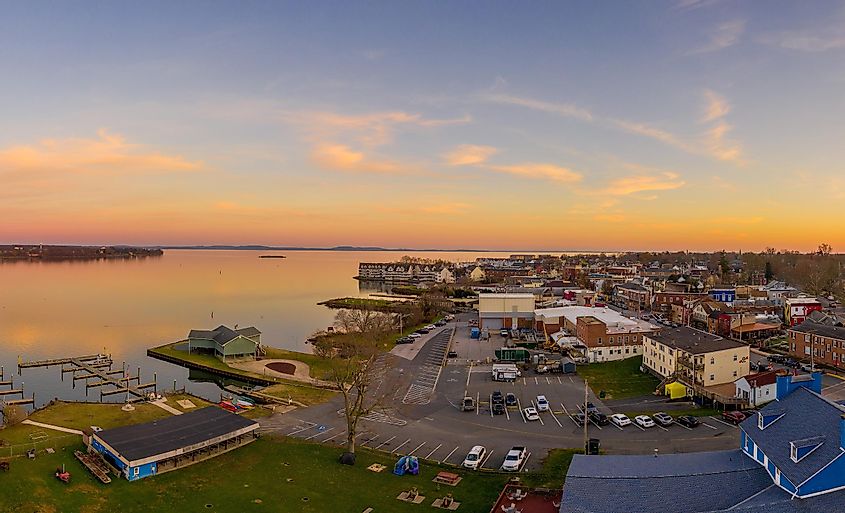 Aerial sunset panorama of Havre de Grace Maryland with orange sky and clouds reflecting on the Susquehanna River and the Chesapeake Bay